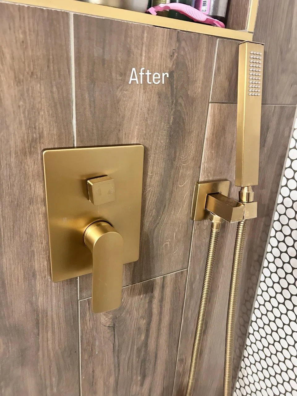 Brass shower controls and handheld shower after cleaning