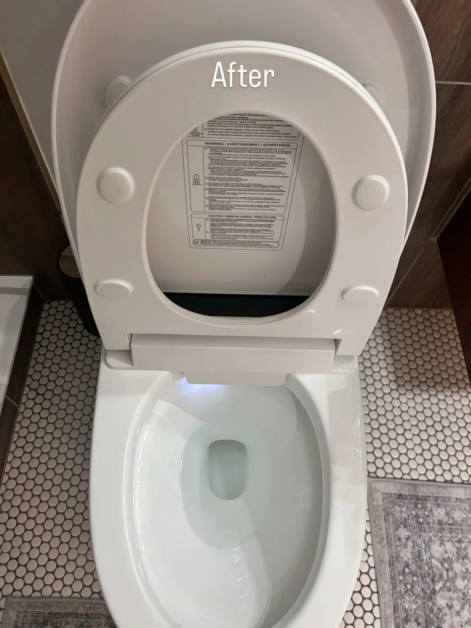 Raised toilet seat and bowl after cleaning